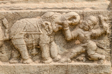 Mural sculpture on stone at Royal Enclosure. Base of Mahanavami Dibba or the Dussehra Platform. Hampi, Karnataka, India, Asia. 