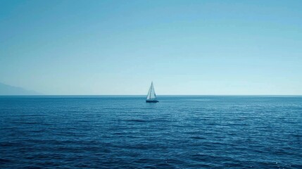 Deep blue sea with a lone sailboat in the distance, emphasizing the vastness and solitude of the ocean