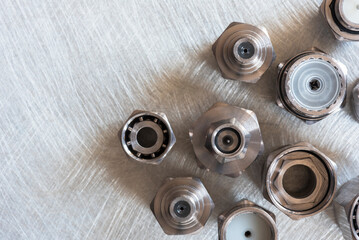 Set of high frequency coaxial connectors on metal surface, top view
