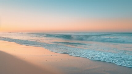 The ocean is calm and the sky is a beautiful shade of pink