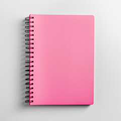 A pink notebook placed in the bottom right corner of a solid white background, ready for note-taking.