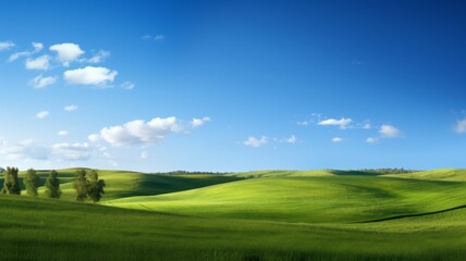 Obraz premium Serene landscape of rolling green hills, lush meadows under a bright blue sky with fluffy clouds. Concept of nature, tranquility, countryside, and idyllic scenery