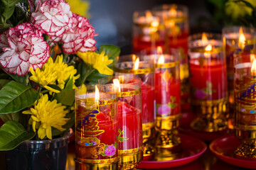 Nonthaburi, Thailand - May, 18, 2024 : Lit Prayer Candles Close Up in Black Background. Hope and Successful Concept at Nonthaburi, Thailand