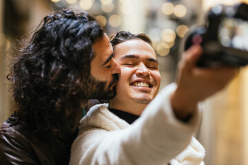 Affectionate gay couple taking a selfie