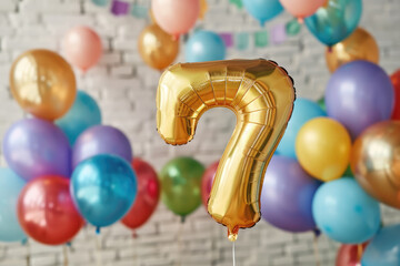 Golden number seven balloon celebrating seventh birthday party