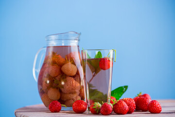 Sweet refreshing berry compote of ripe strawberries in a decanter