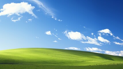 Fototapeta premium Idyllic Rolling Green Hills Under Blue Sky with Fluffy White Clouds. Concept of nature, peace, tranquility, and serenity.