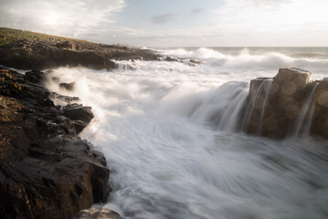 Dramatic Waves Crashing on The Rock