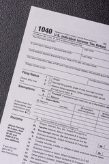 Fototapeta premium Fill out US tax form 1040 for verification and refund