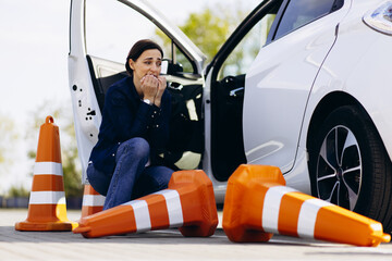 Woman upset cause of hitting cones while passing drivers test © Petro