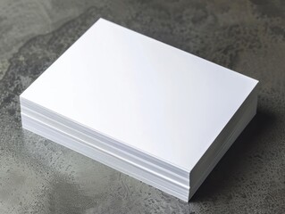 Stack of blank white paper sheets on a textured surface, ideal for office, writing, printing, or craft projects.
