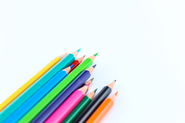 a bunch of colored pencils isolated on white background close up