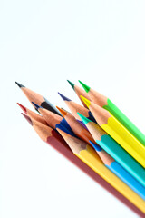 a bunch of colored pencils isolated on white background close up