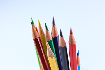 a bunch of colored pencils isolated on white background close up