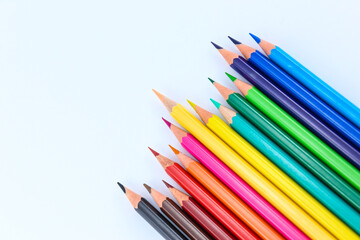 a bunch of colored pencils isolated on white background close up
