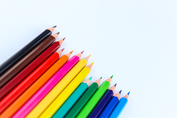 a bunch of colored pencils isolated on white background close up