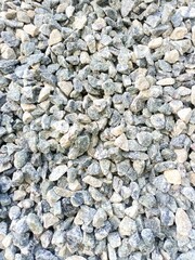Small stone gravel texture background. Gray gravel pebbles stone texture, seamless texture
