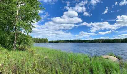 Finnish blue lake white clouds summer landscape