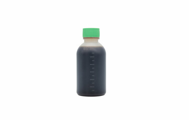 A small plastic bottle with dark Chinese medicine close-up isolated on white background