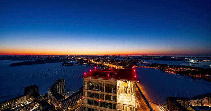 Time lapse of the illuminated Majakka tower roof, vivid winter dawn in Helsinki