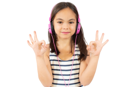 Cheerful happy little girl with headphones making okay sign over transparent background.
