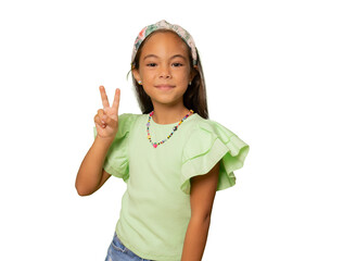 Young beautiful child girl standing over transparent background smiling with happy face winking at...