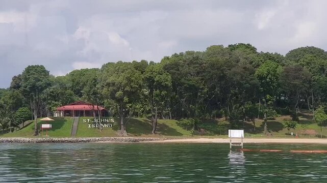 footage of ferry leaving the St John's Island of Singapore during the day time.