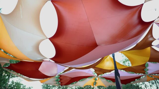 Colorful canopy made of fabric, creating a vibrant overhead decoration