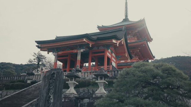 West Gate (Saimon) And Sanjunoto Pagoda Of Kiyomizu Temple In Kyoto, Japan. low angle, tilt-up shot