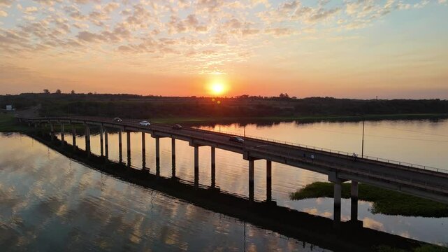Spectacular aerial view during sunset of the bridge over the Paran&aacute; River in the province of Misiones, Argentina. 4k drone.