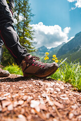 Hiker with Hiking Shoes Standing on a Hiking Path Taking a Break