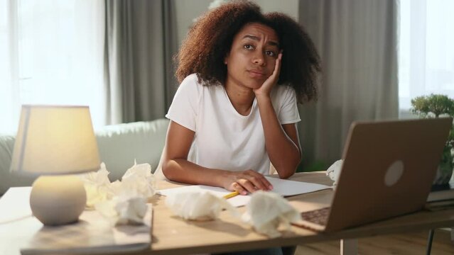 Portrait of exhausted tired young woman student or freelancer with failed ideas while take break at home workplace Tired female with creative block or lack of inspiration indoors	
