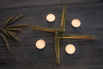 Wiccan altar for Imbolc sabbath. religion winter-spring pagan festive ritual. Brigid's cross,...