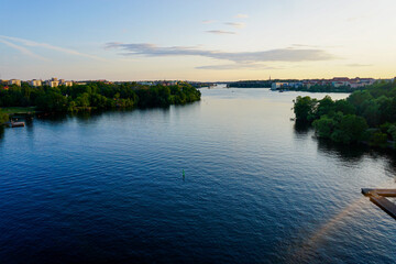 Scenic view of river against sky at sunset