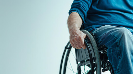 Obraz premium closeup of a disabled person in a wheelchair, isolated on a white background, determined expression, with space for text 