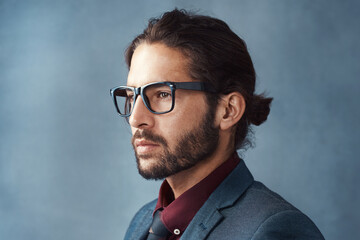 Obraz premium Vision, thinking and business man with glasses for idea in profile isolated on studio background. Planning future, face and serious person remember memory, reflection or problem solving for decision