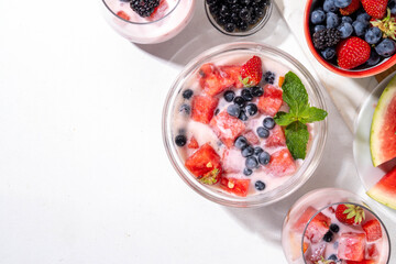 Subak Hwachae cocktail, Korean traditional watermelon punch salad drink, with a lot of fruit slices, with tapioca boba pearls, in glass and bowl for party, copy space
