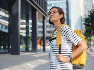 Asian woman over background of modern urban architecture in Vienna.