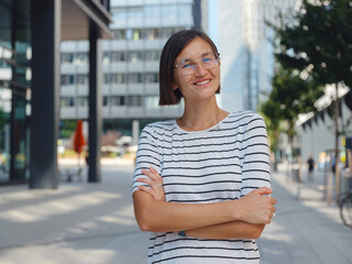 Asian woman over background of modern urban architecture in Vienna.