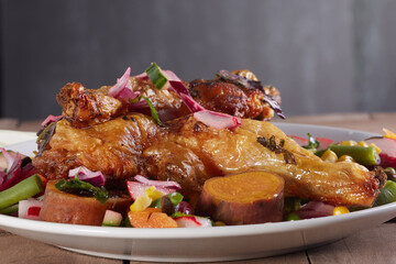 Roasted chicken leg with a beetroot salad.