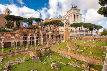 Naklejka premium Rome, Italy with Monument to Victor Emmanuel II and ancient Roman Ruins