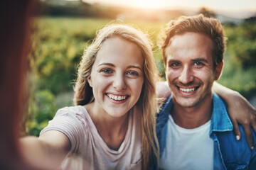 Obraz premium Couple, portrait and selfie in nature outdoor for agriculture, sustainable farming and smile for harvest season with post. Man, woman and photography on land for environment, memory and personal blog