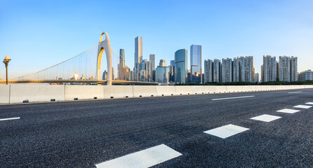 Asphalt highway road and bridge with modern city buildings scenery in Guangzhou. car advertising...