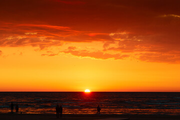 A beautiful sunrise over the Baltic sea - horizon and colorful sky. Natural summer scenery at the Baltic beach in Latvia, Northern Europe.