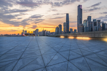 Empty square floor with modern city buildings scenery at dusk in Guangzhou. car background.