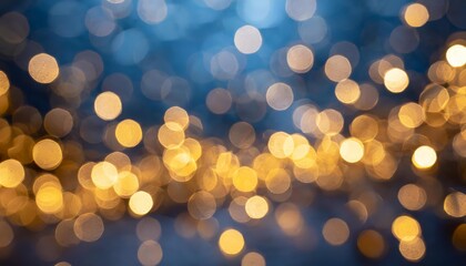 Fototapeta premium Golden Bokeh Lights on Dark Blue Background Create Festive Atmosphere