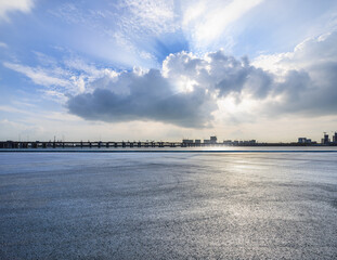 Fototapeta premium Asphalt road square and sky clouds natural landscape. car background.