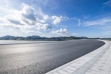 Asphalt highway road and coastline with sky clouds nature landscape. car background.