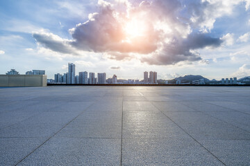 Empty square floor and city skyline with sky clouds nature background