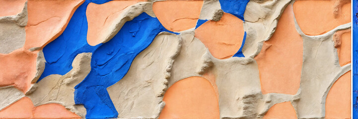 Peach and royal blue plastered wall texture